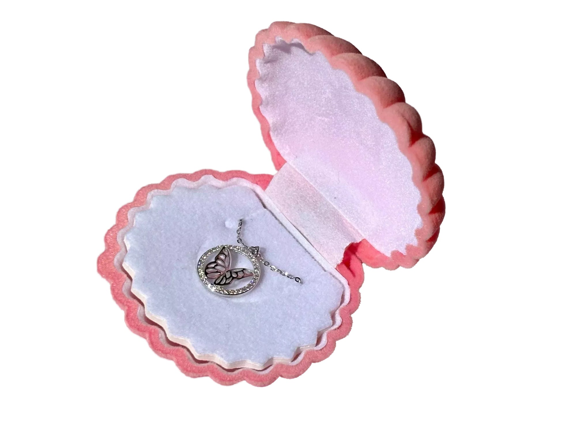 A pink and white jewelry box containing a silver necklace with a butterfly pendant.