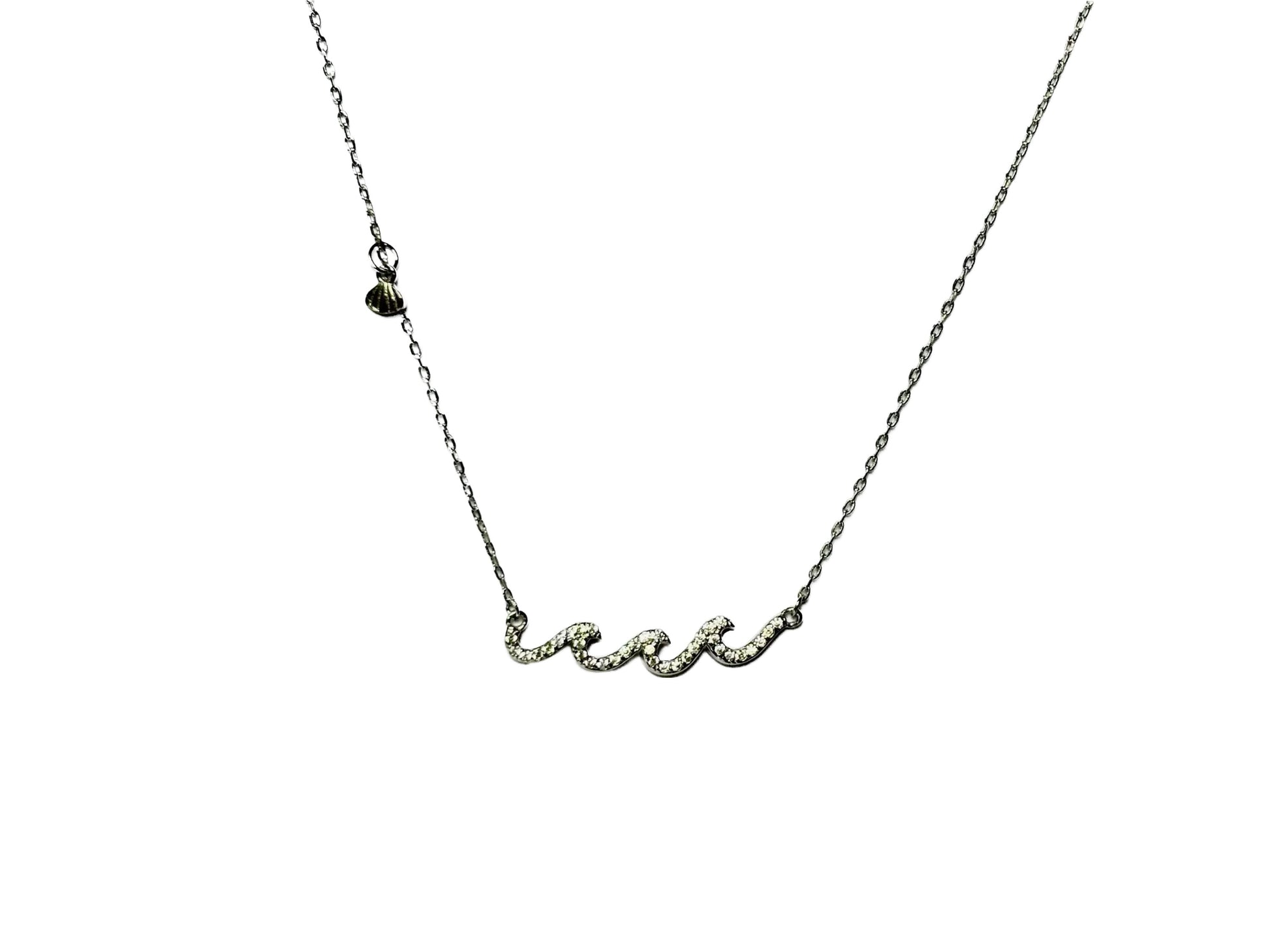 A silver necklace with a cursive pendant.