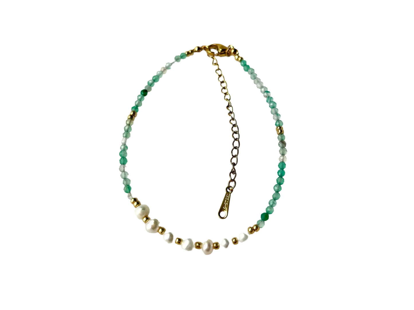 A necklace with green and white beads, white pearls, and a gold clasp.