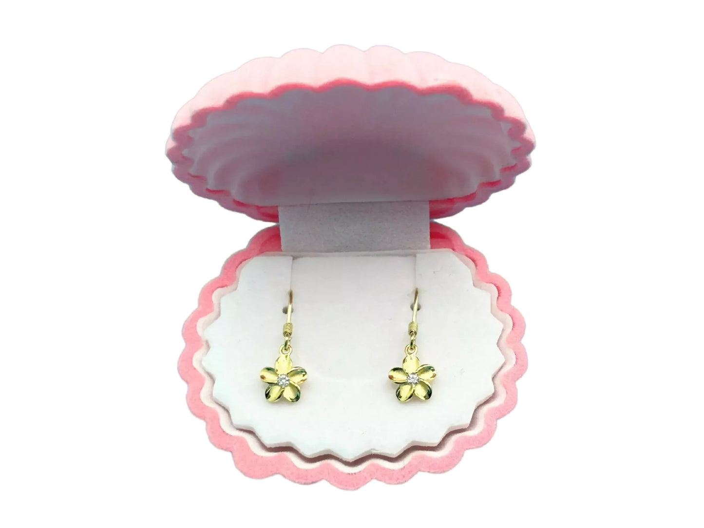 A pink shell-shaped jewelry box containing a pair of gold earrings with flower-shaped charms.