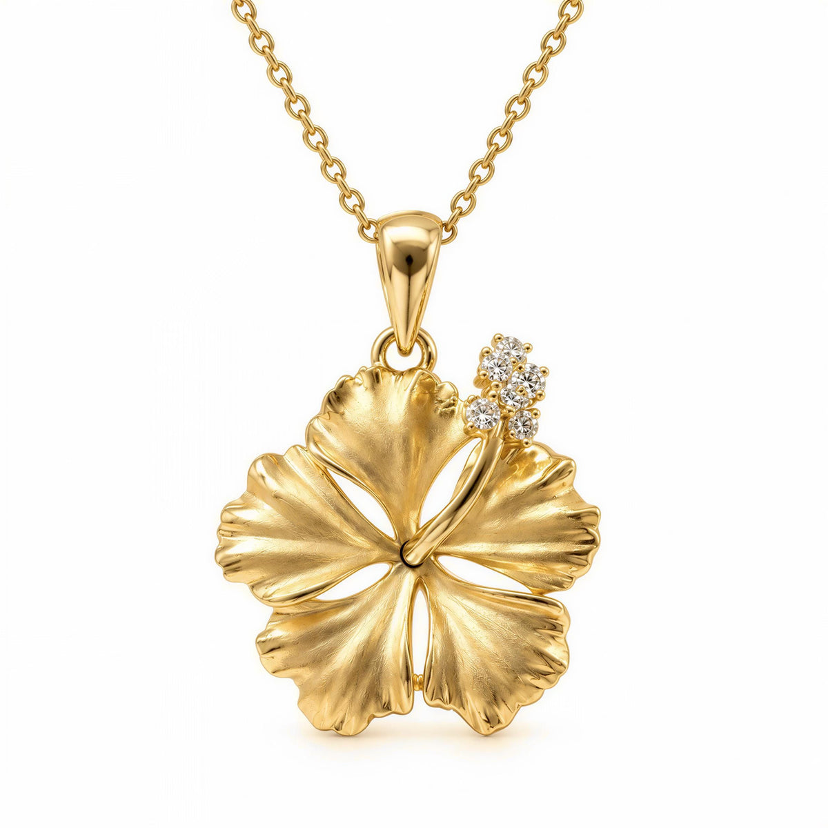 A gold-colored pendant necklace with a large, intricately designed flower-shaped pendant featuring a hibiscus flower design and small diamonds.