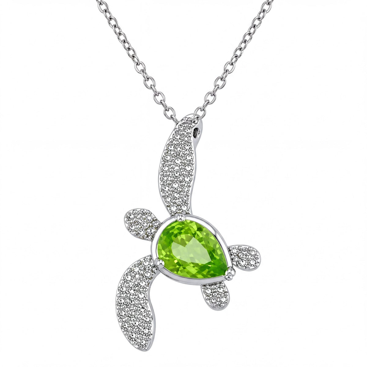 A silver necklace with a pendant featuring a green gemstone, likely a gemstone like a pear or a similar shape.