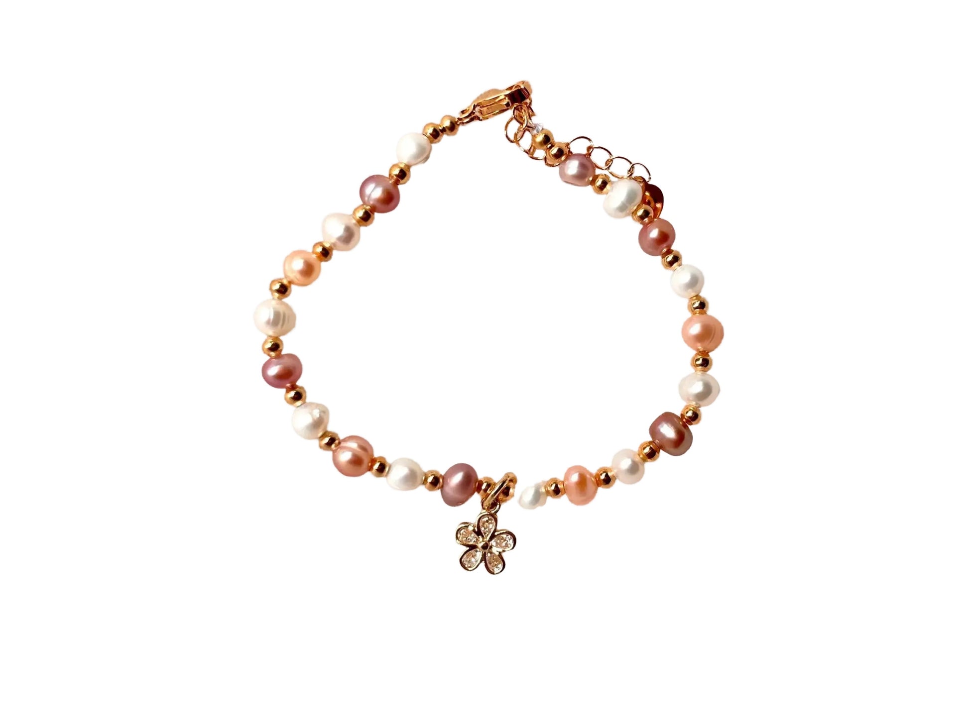 A bracelet made of small beads, including pearls and diamonds, with a charm pendant.
