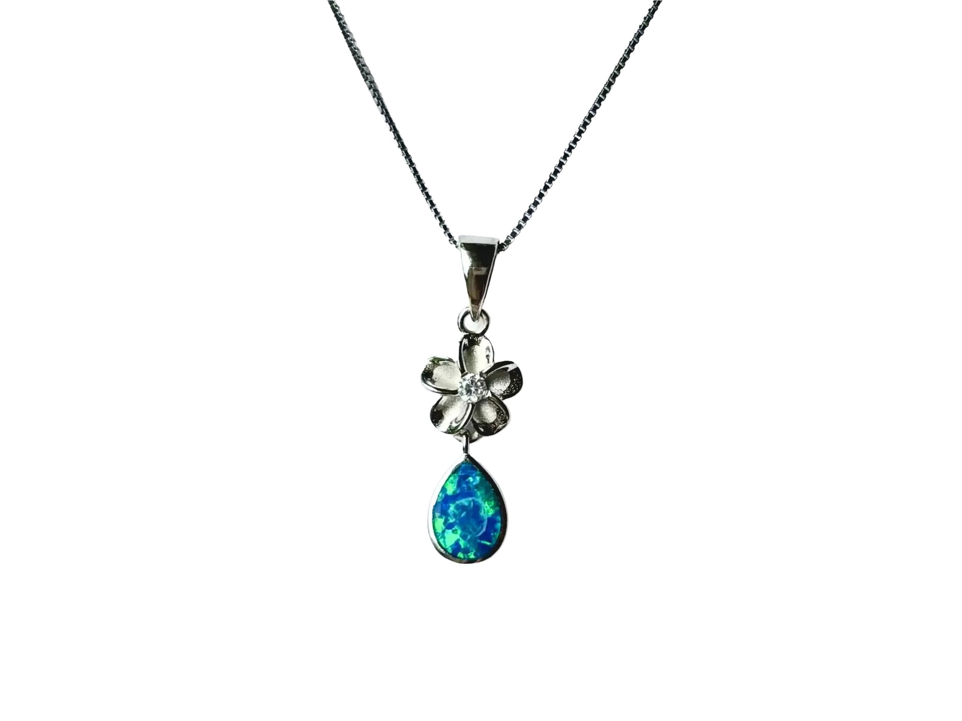 A silver necklace with a pendant featuring a flower and a teardrop-shaped gemstone.