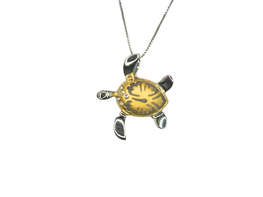 A necklace with a pendant in the shape of a yellow turtle.