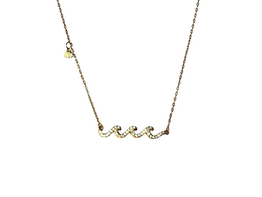 A gold necklace with a pendant in the shape of a wave.