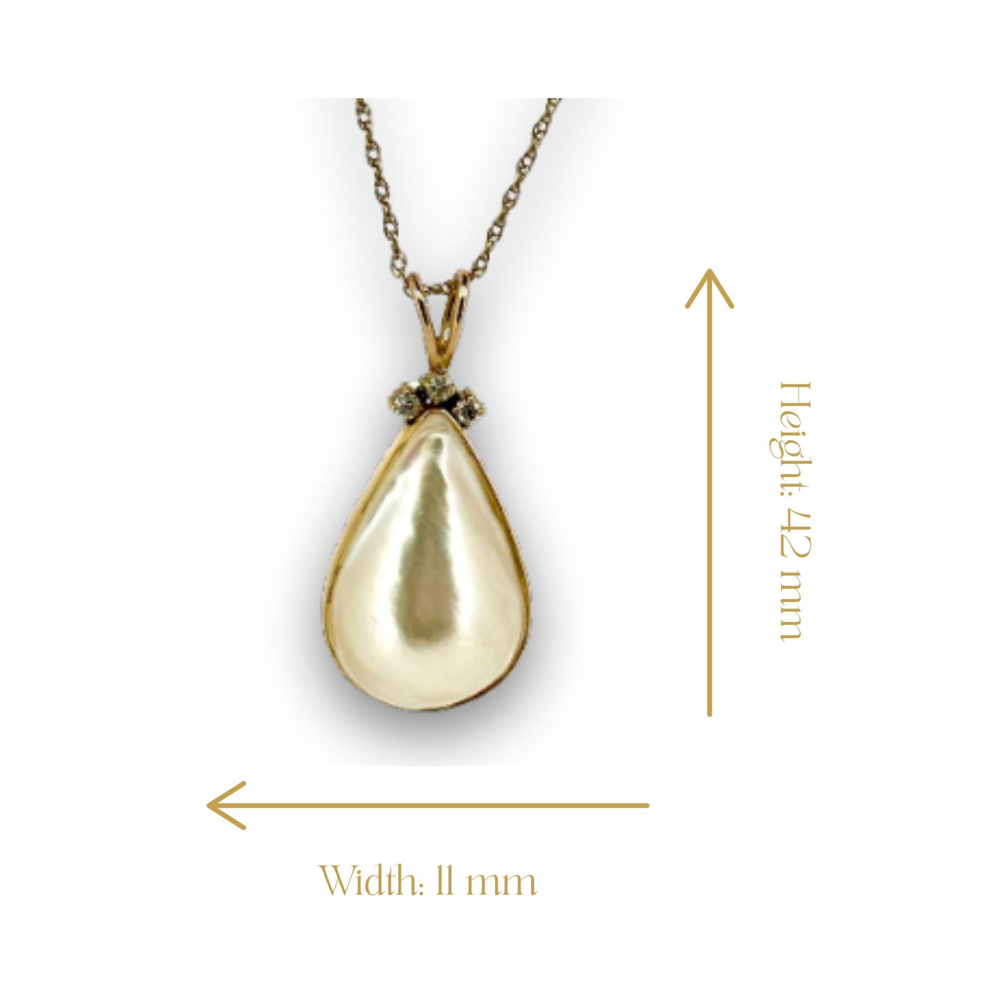 a gold pendant with a diamond on it