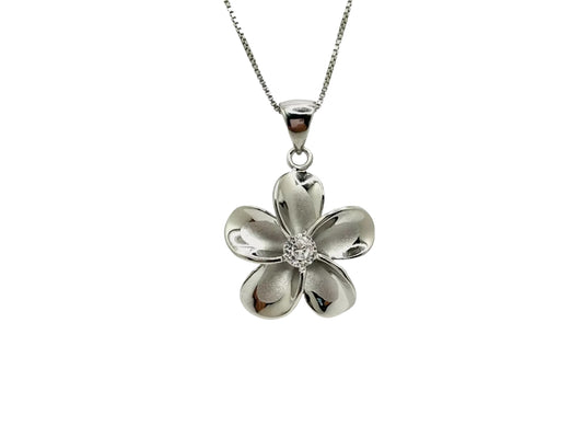 A silver-colored pendant necklace with a single flower-shaped pendant featuring a small gemstone in the center.