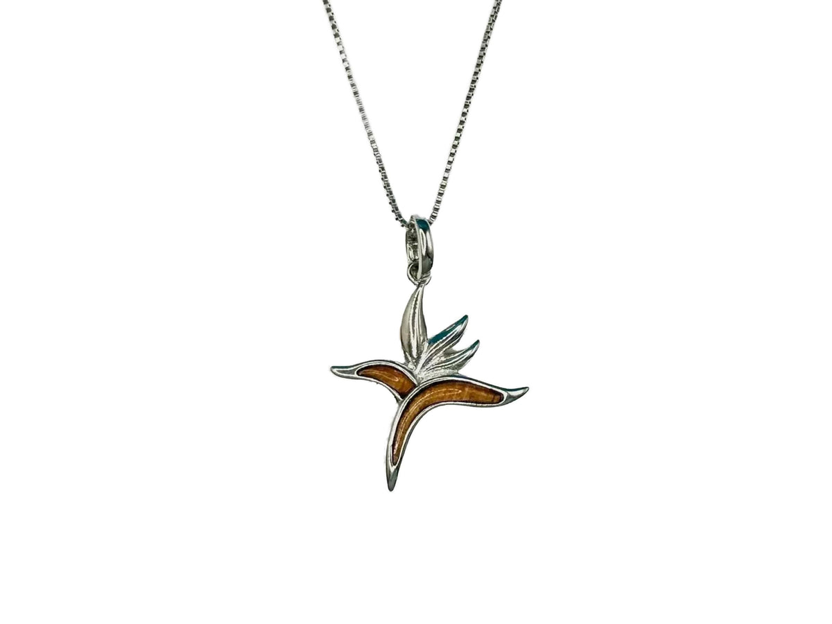 A silver necklace with a pendant featuring a stylized bird-like design.